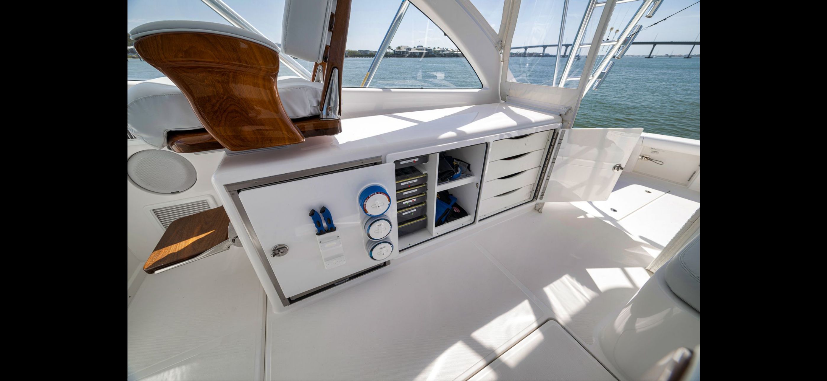Interior of 2022 Mag Bay 42 Express with storage and controls.