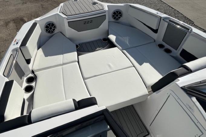 2026 Yamaha Boats 222S interior with spacious white seating and cup holders.