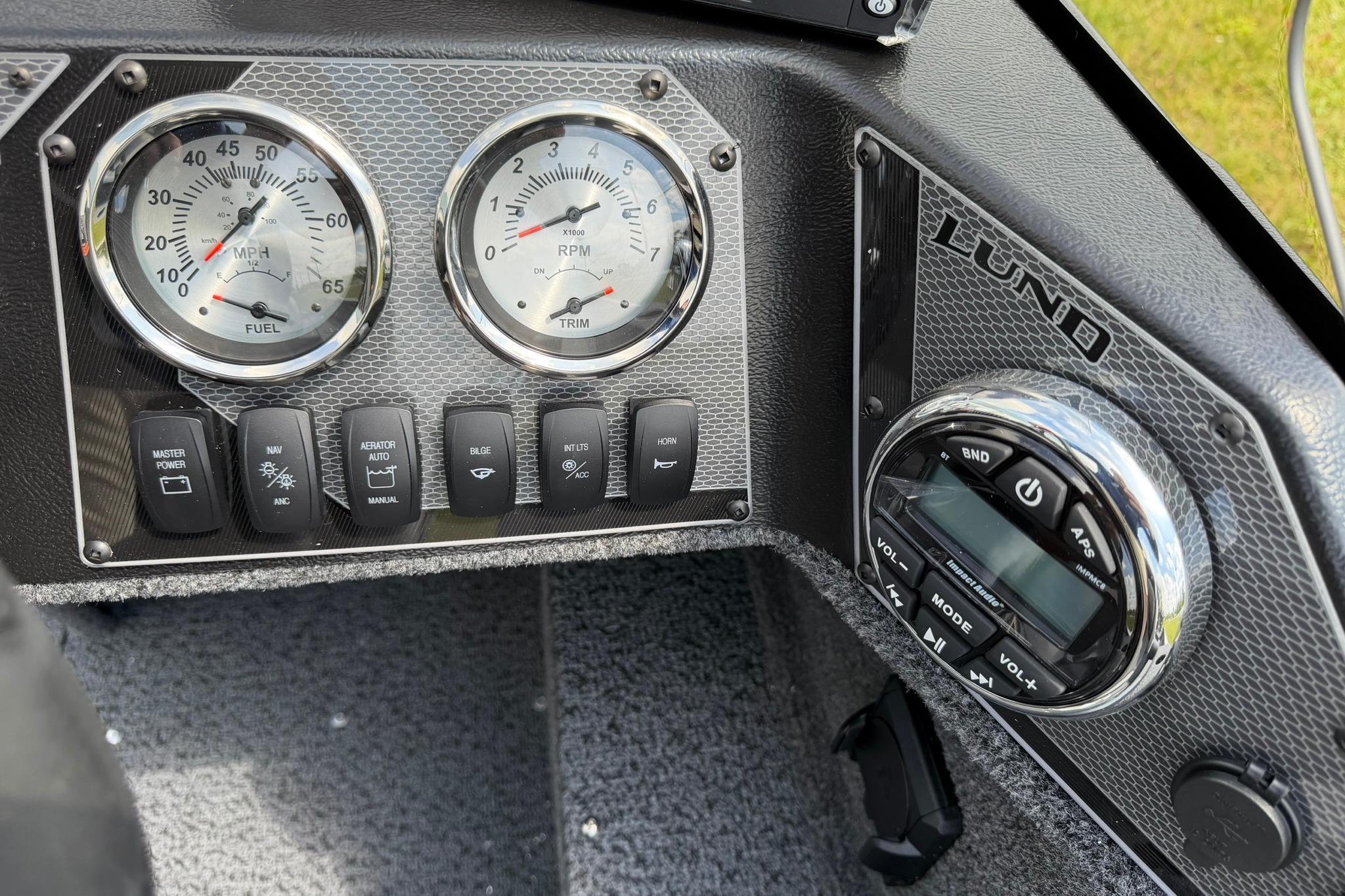Dashboard of 2027 Lund 1650 Rebel XL SS boat with gauges and controls.