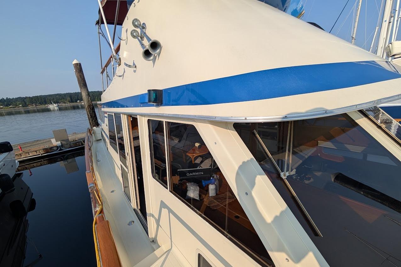 1978 Tollycraft 54 Custom Cockpit Motor Yacht docked at marina, side view.