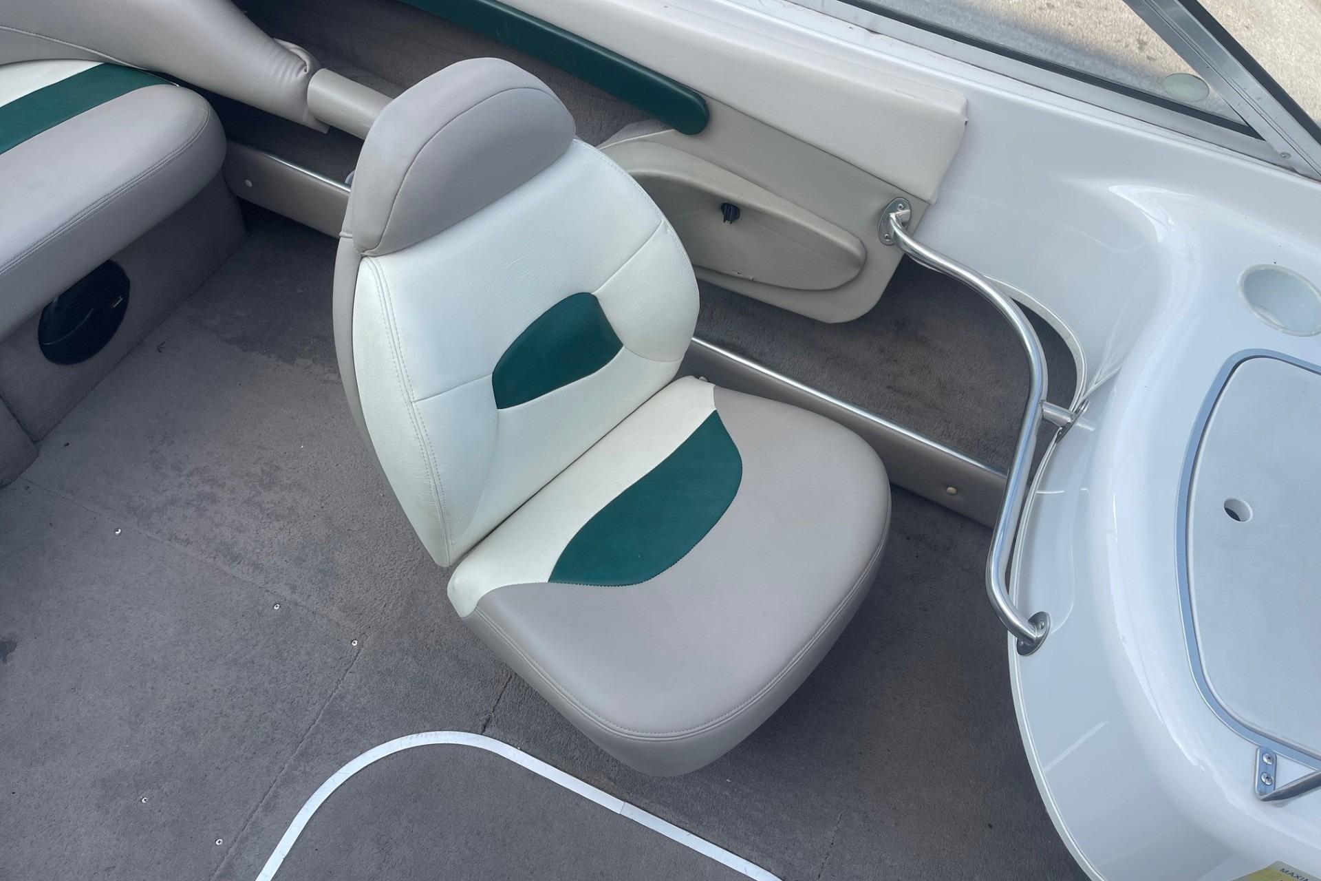 1996 Four Winns 200 Horizon boat interior with gray and green seating.