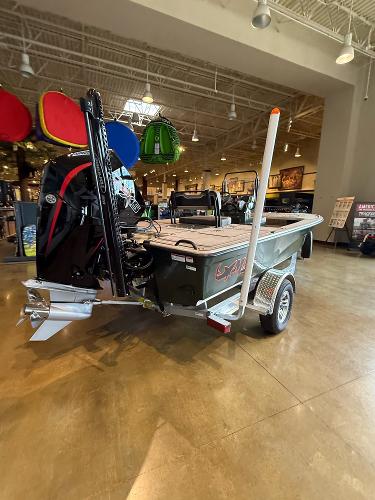 2025 Mako 18 Pro Skiff Backwater Edition displayed indoors on a trailer.