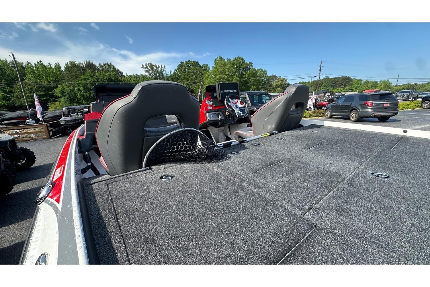 2023 Nitro Z20 Pro fishing boat interior with seats and steering wheel, parked outdoors.