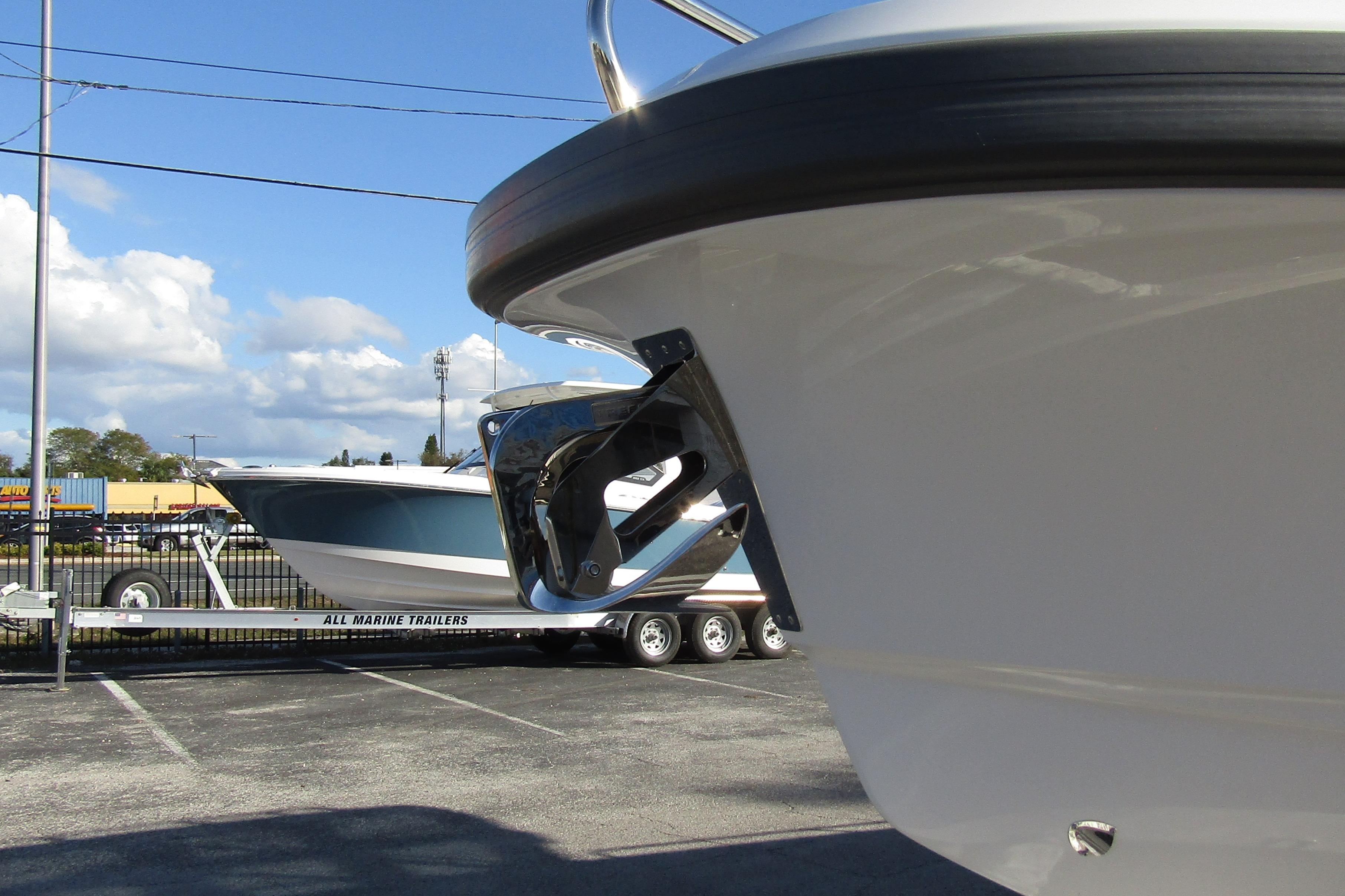 2025 Nimbus Tender 9 boat on trailer under clear sky.