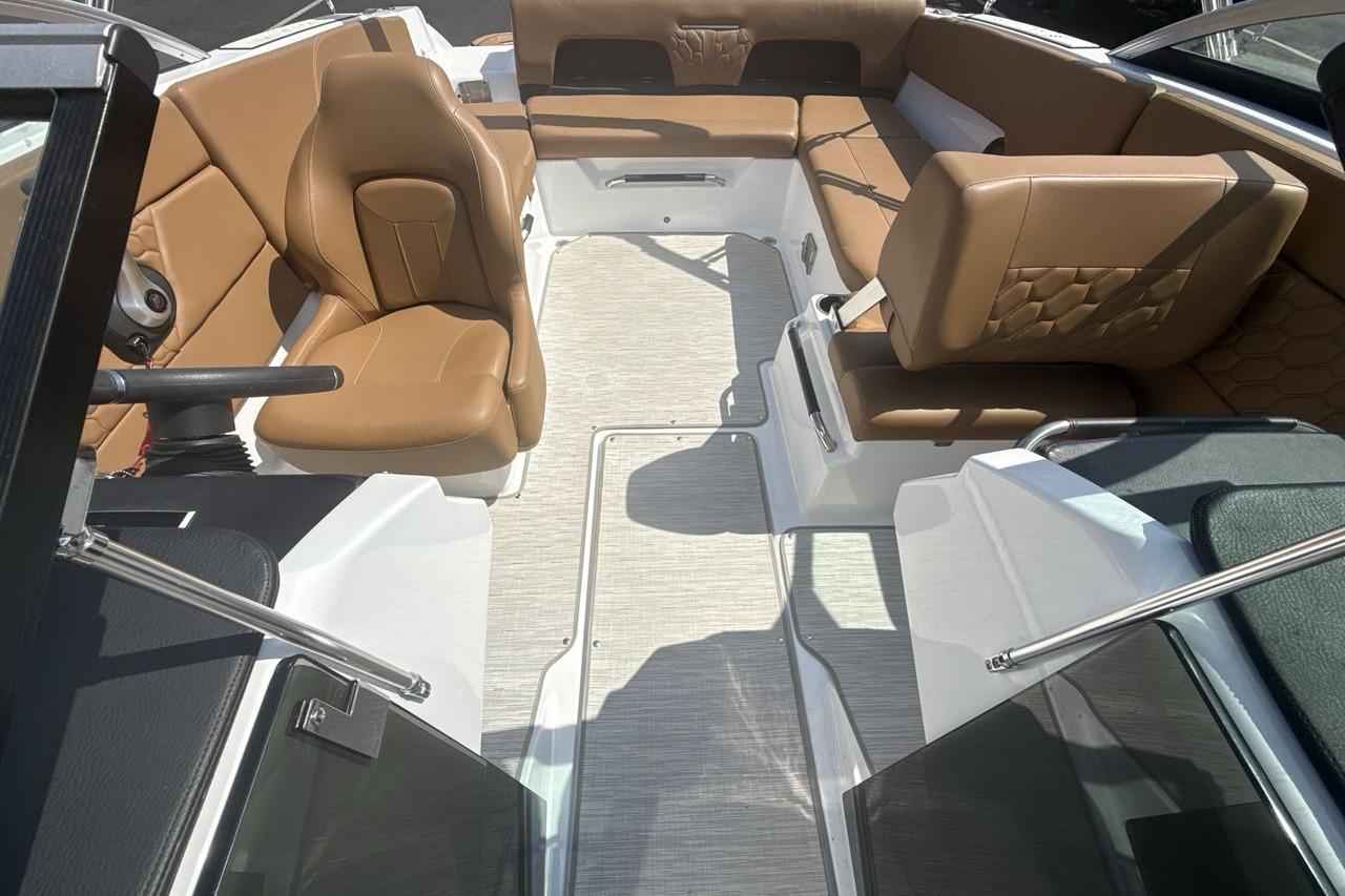 2024 Four Winns H1 OB boat interior with tan leather seating and modern design.