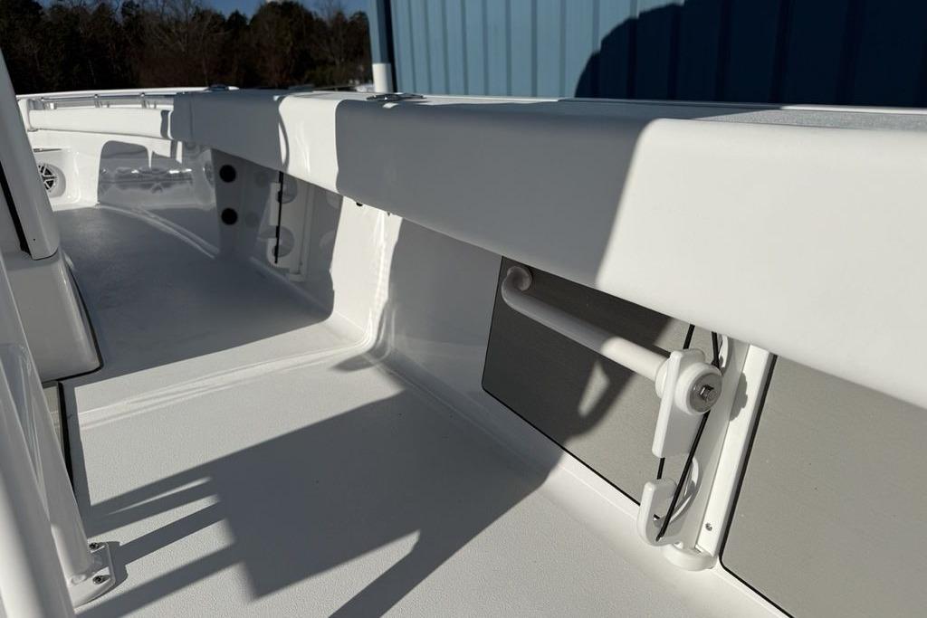 2026 Sportsman Masters 247OE Bay Boat interior, showcasing sleek white design and storage features.