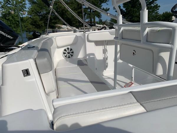 2024 Tahoe 2150 CC boat interior with white seating and storage compartments.