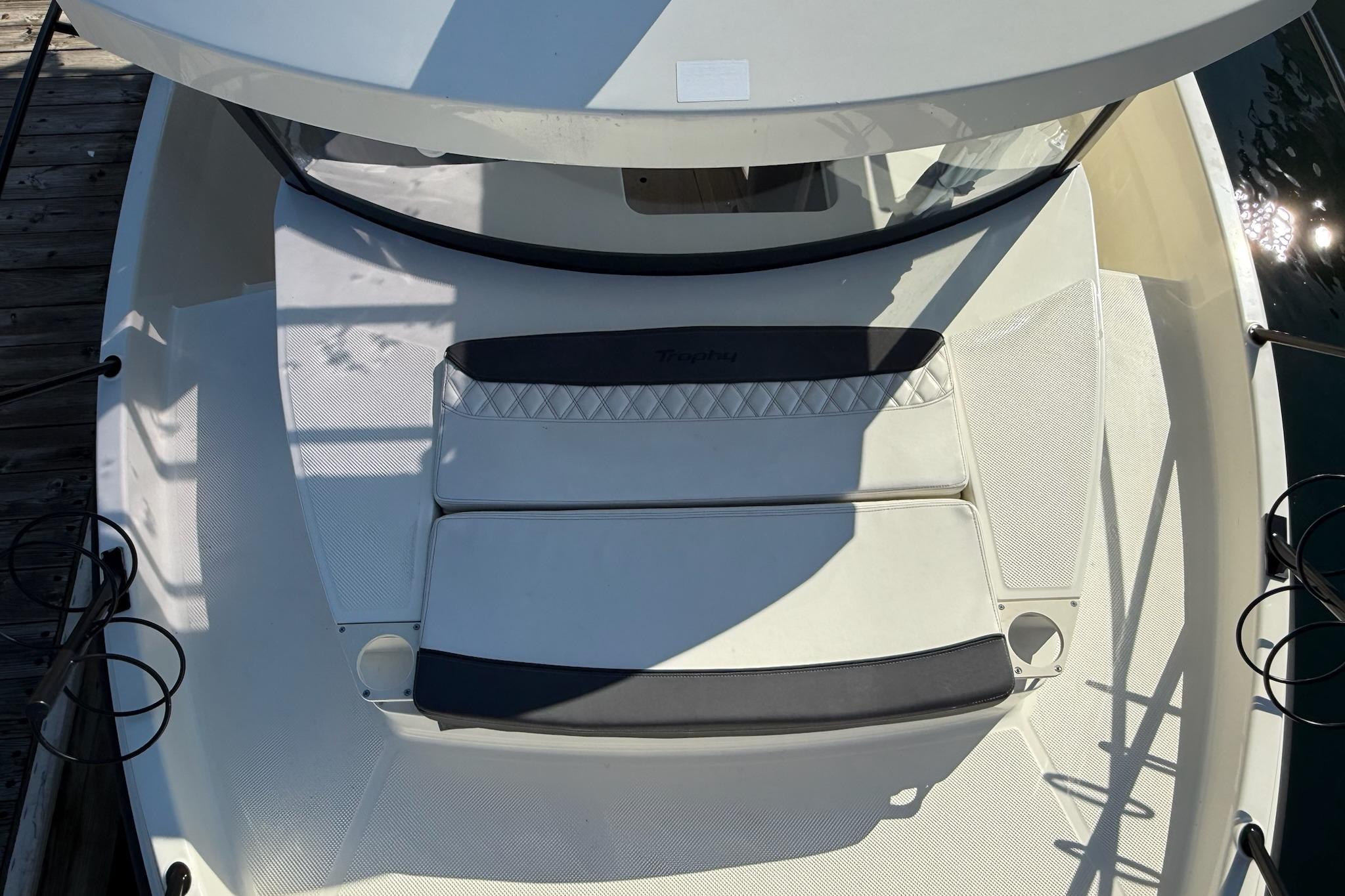 2024 Bayliner Trophy T25 Pilothouse boat deck with cushioned seating.