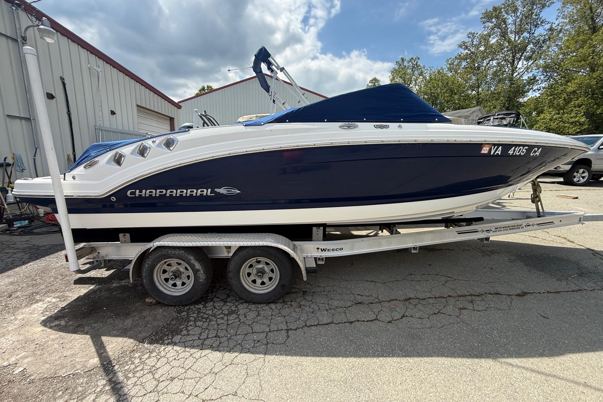 2016 Chaparral 226 SSi Wide Tech boat on trailer, parked outdoors.