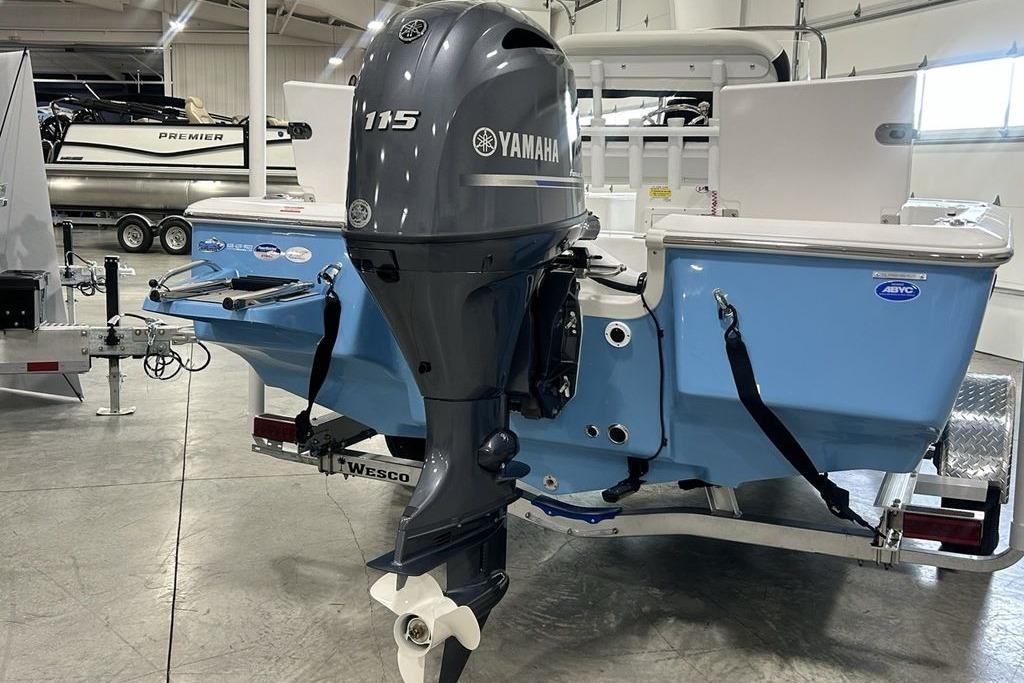 2026 Tidewater 1910 Bay Max boat with Yamaha 115 outboard motor in showroom.