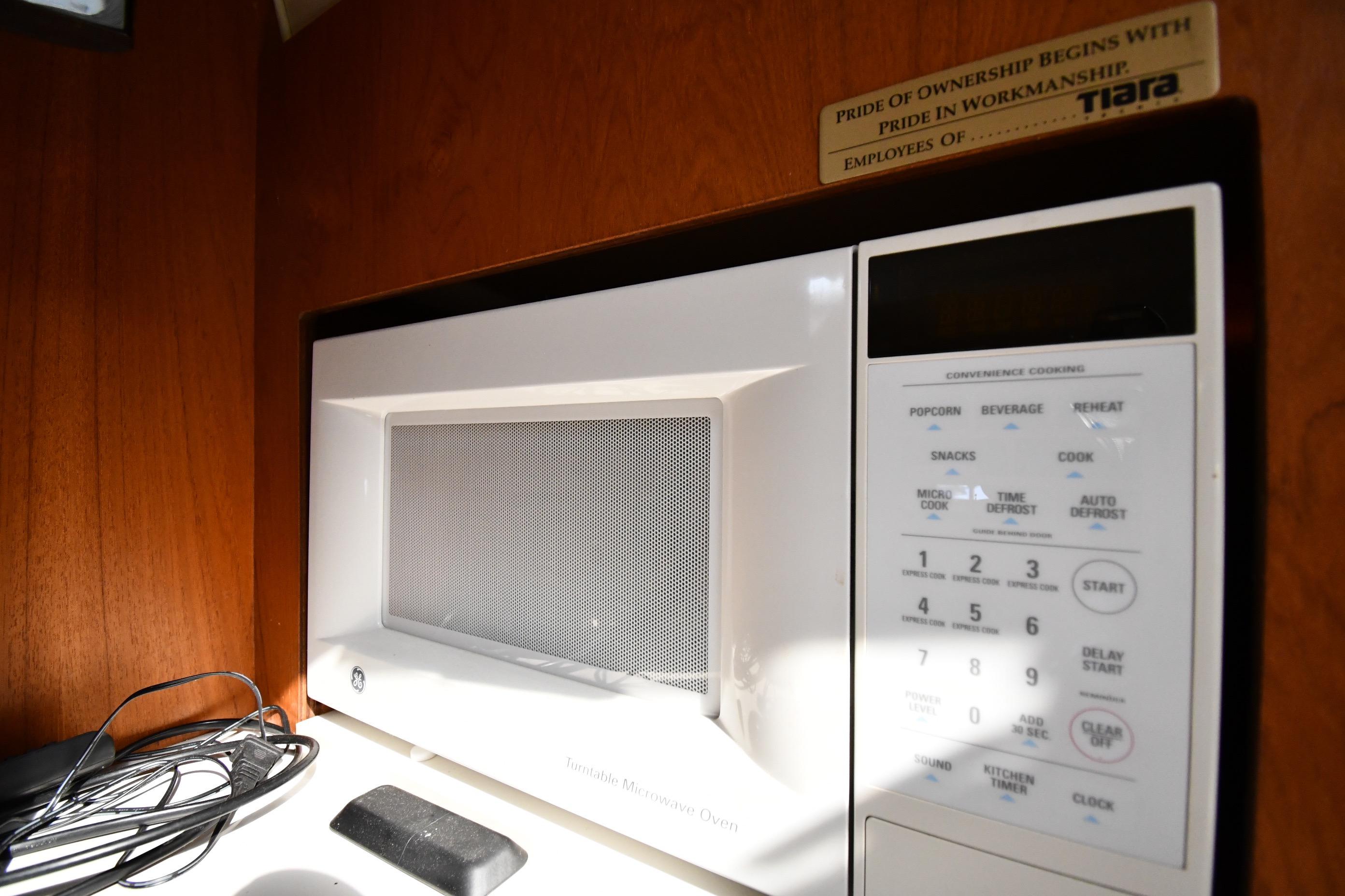 Microwave in 1998 Tiara Yachts 3100 Open, showcasing convenience cooking options.