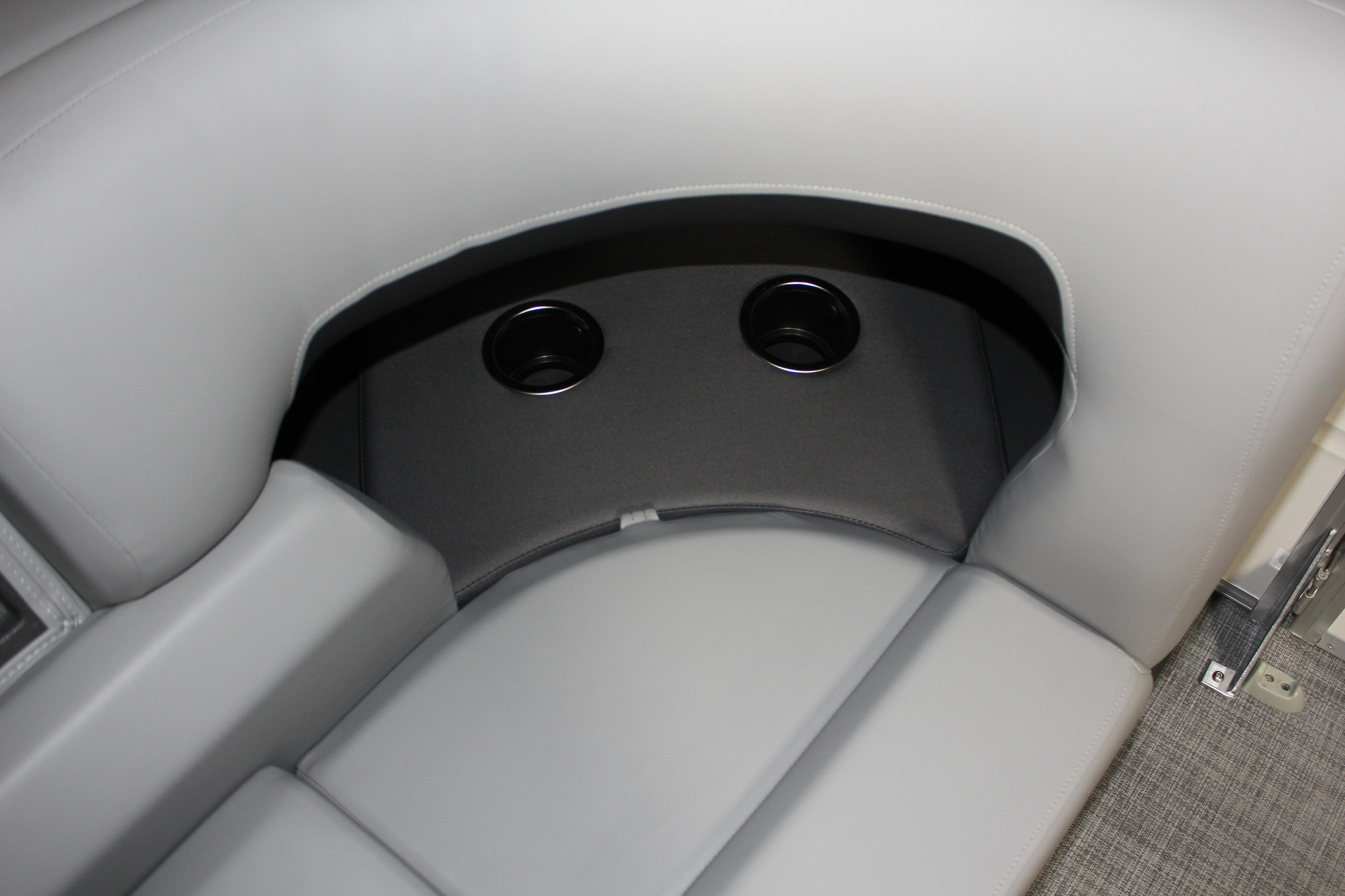 2026 Sun Tracker Party Barge 22 DLX interior seating with built-in cup holders.