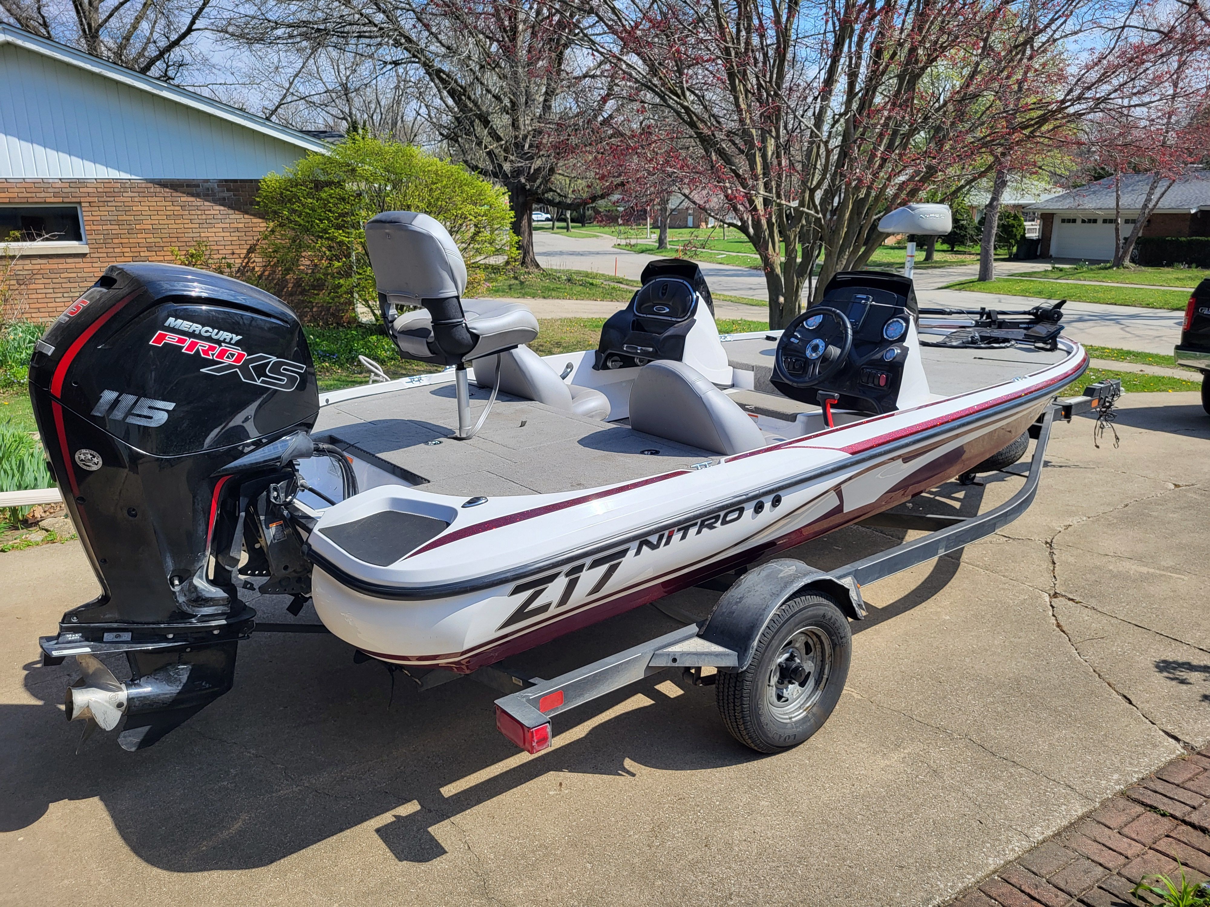 A 2017 Nitro Z17 boat on a trailer in a driveway.