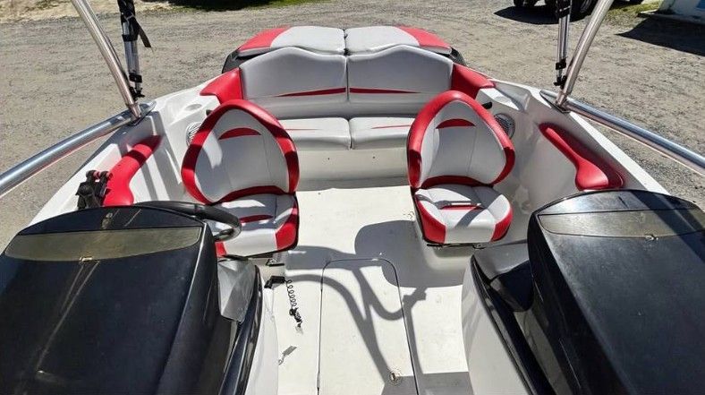 Interior view of a 2008 Sea-Doo SPEEDSTER 200 with red and gray seating.