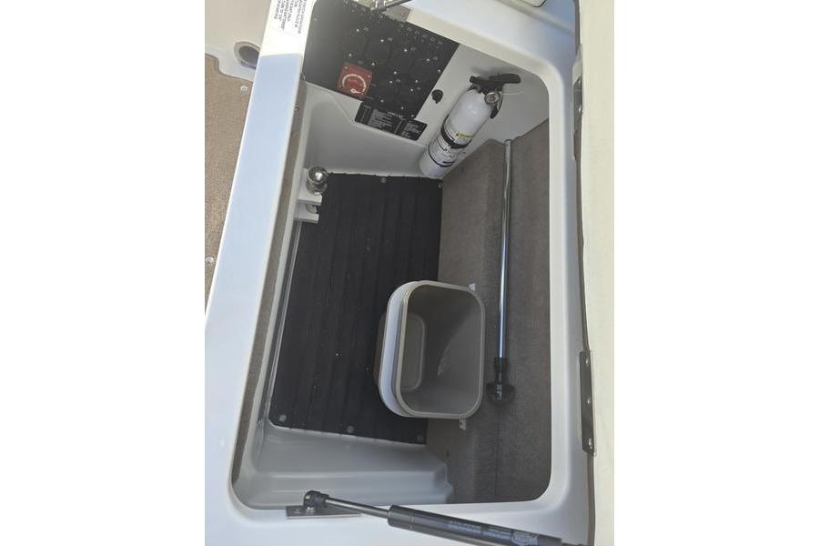 2022 Cobalt R4 storage compartment with fire extinguisher and utility bin.
