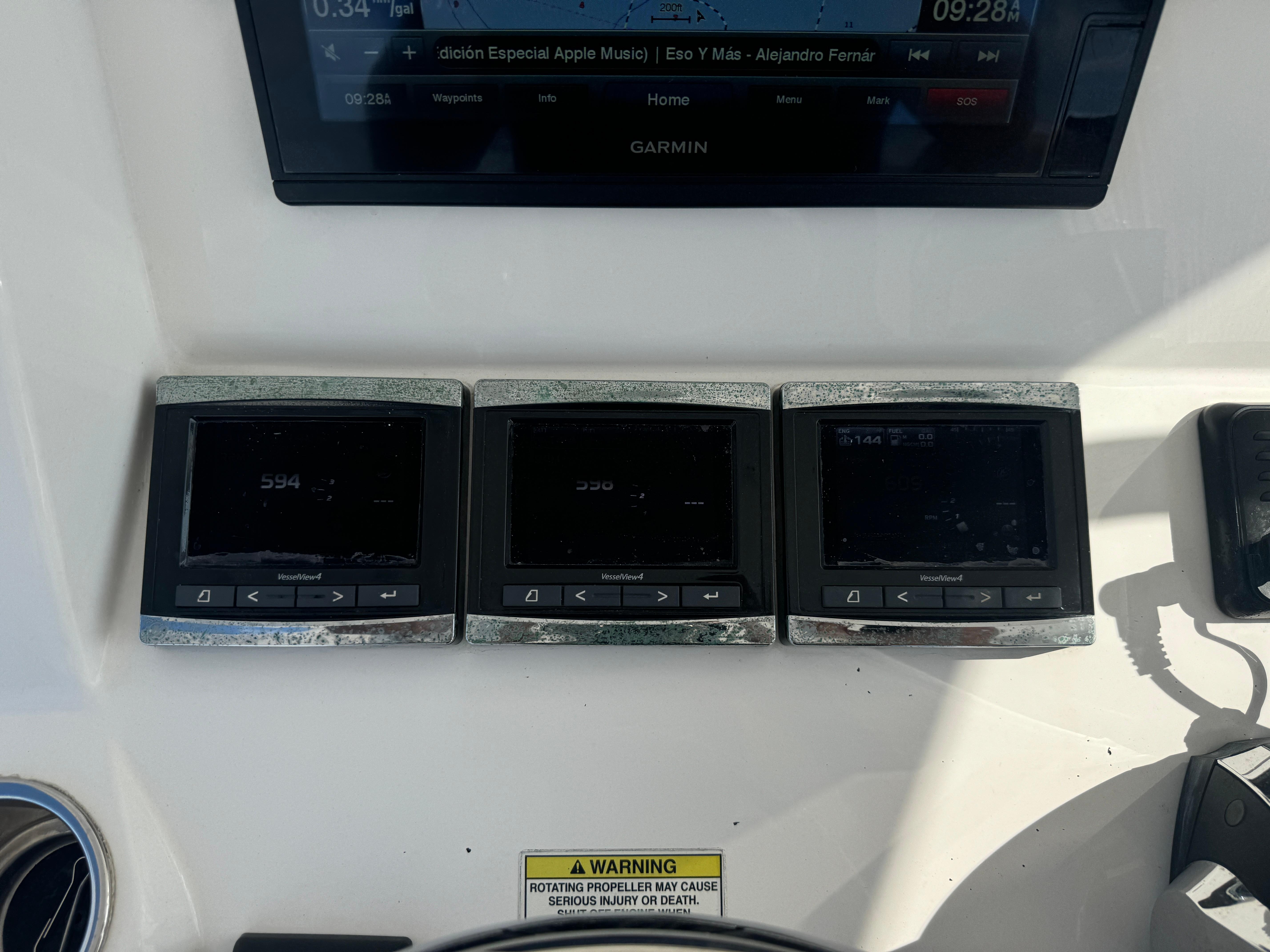 Control panel of a 2016 Intrepid 375 CC boat with multiple digital displays.