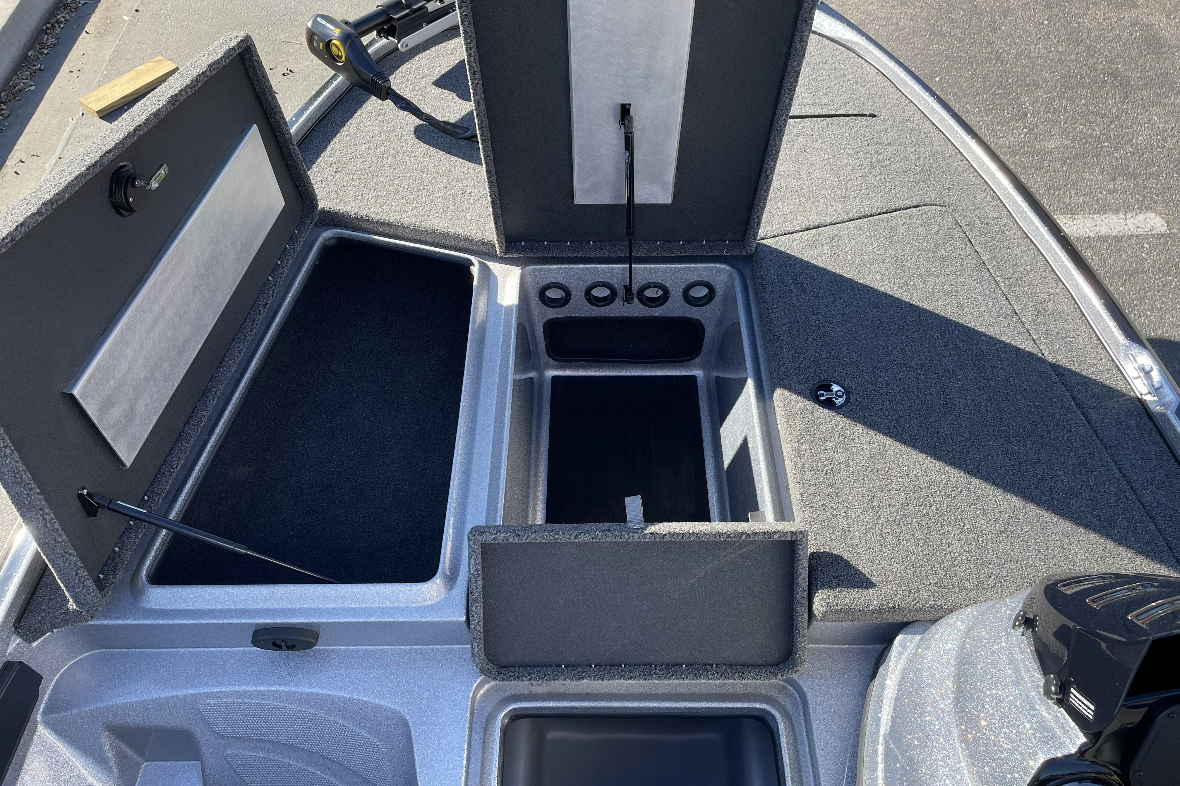 Open storage compartments on a 2026 Nitro Z17 boat deck.