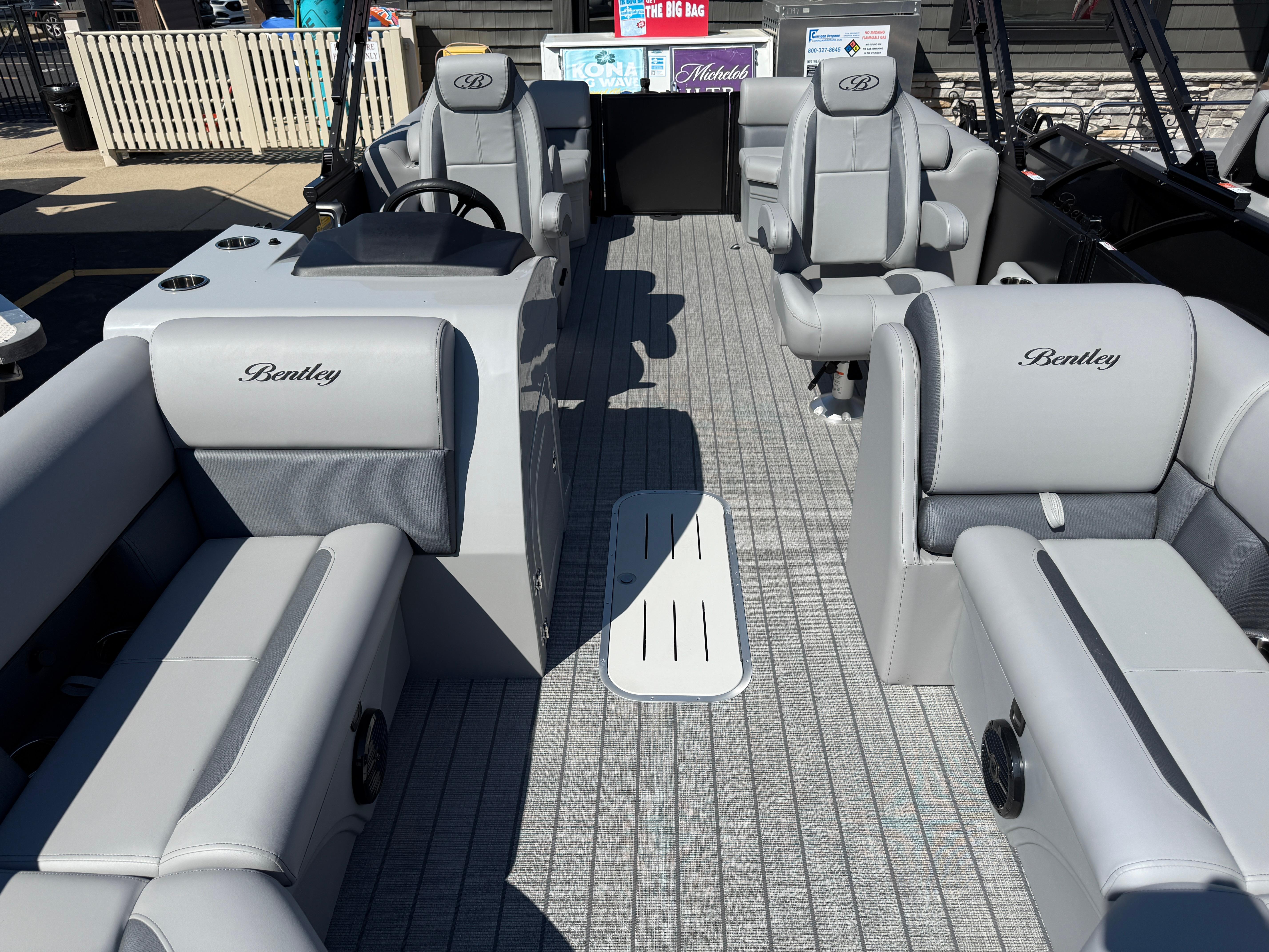 2026 Bentley Pontoons Legacy 223 Navigator interior with luxurious gray seating and modern design.