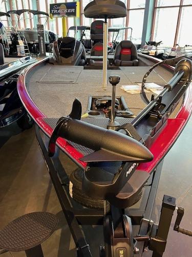 2025 Tracker Savage 215 boat with trolling motor, displayed indoors.