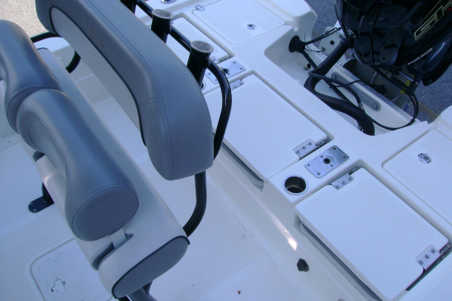 2022 NauticStar 227 XTS boat interior with seating and storage compartments.