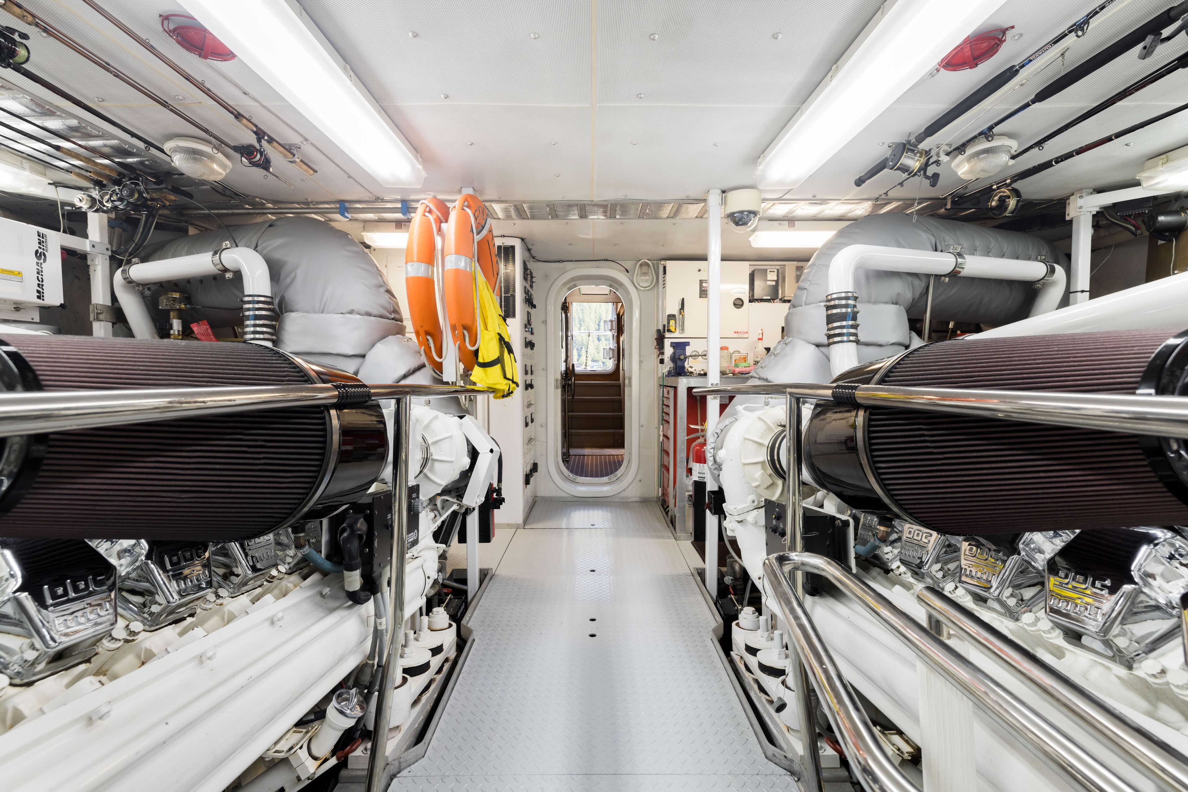 Engine room of a 2000 Westport Crescent yacht with dual engines and safety equipment.
