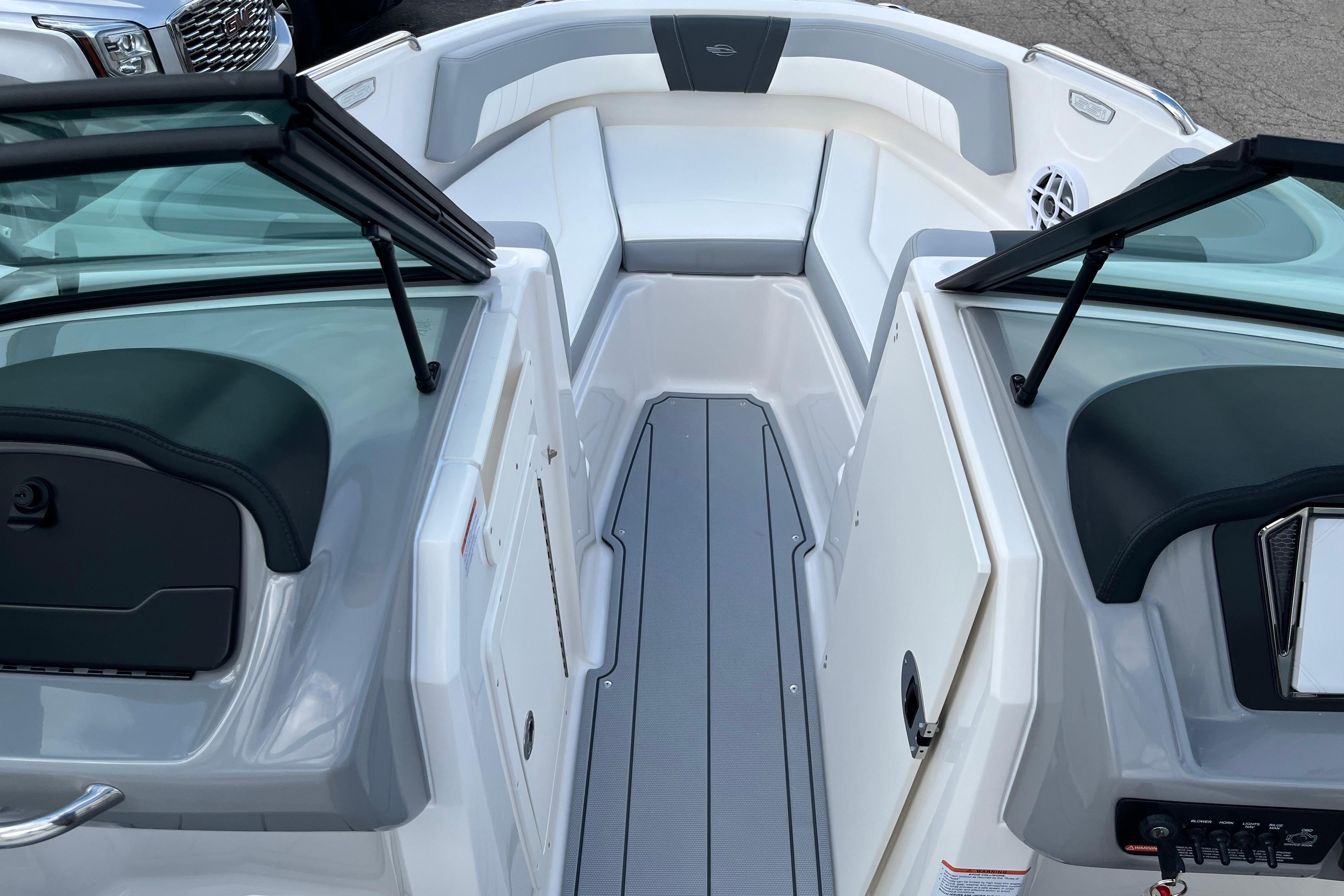 2026 Chaparral 21 SSi boat interior with open windshield and seating area.