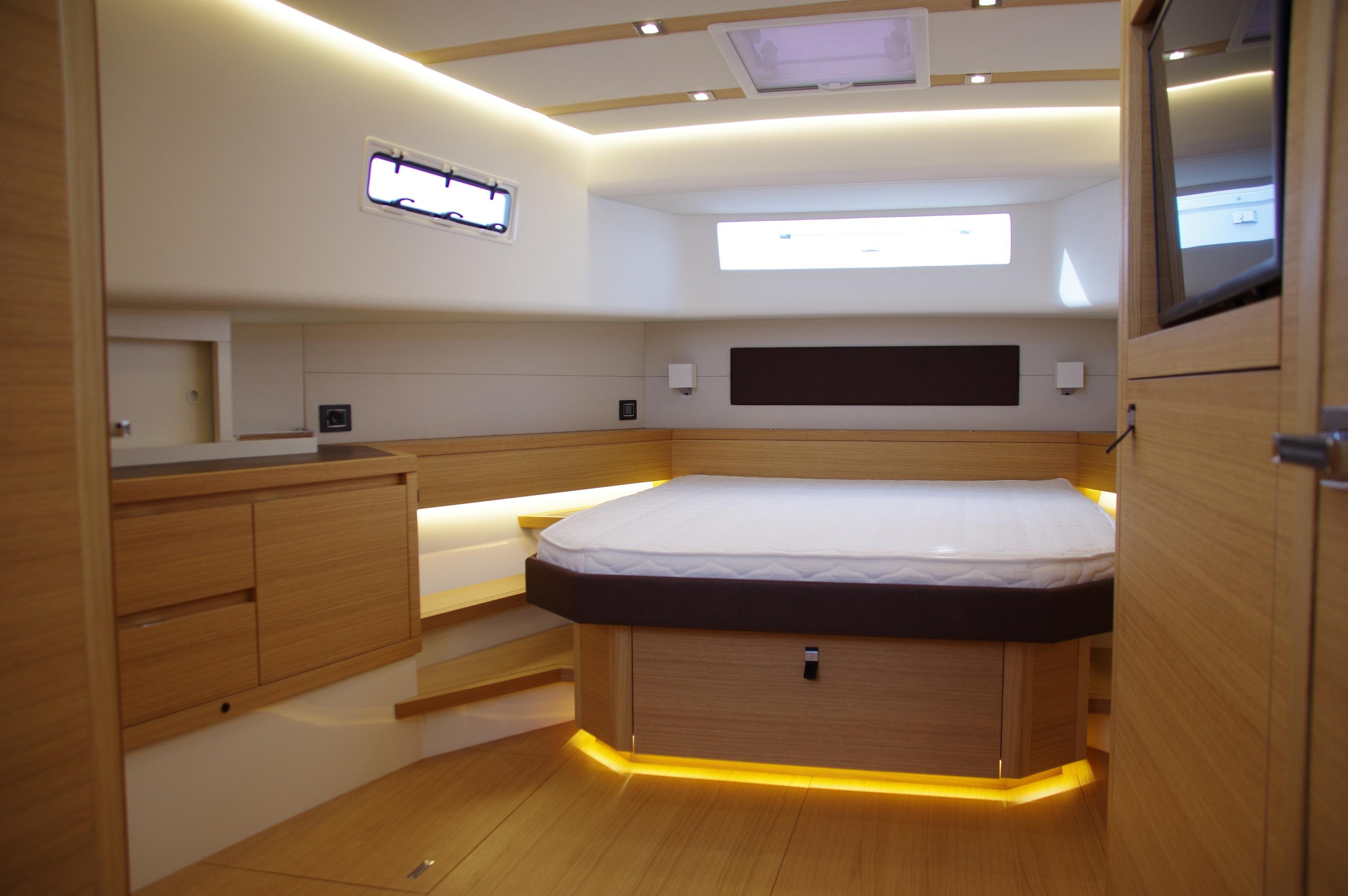 Luxurious interior of 2025 Pardo Yachts 50, featuring modern wood finishes and ambient lighting.