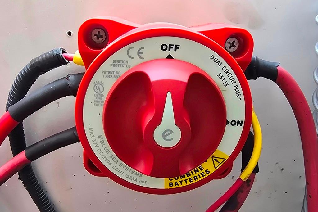 Red battery switch on a 2006 Sea Ray 185 Sport boat, labeled "Dual Circuit Plus."