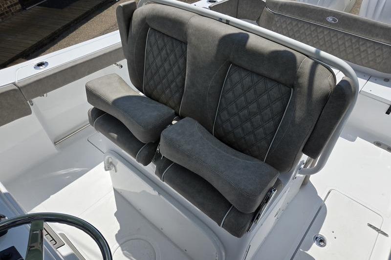 2027 Sea Hunt Ultra 275 SE boat with cushioned seating and diamond-pattern upholstery.