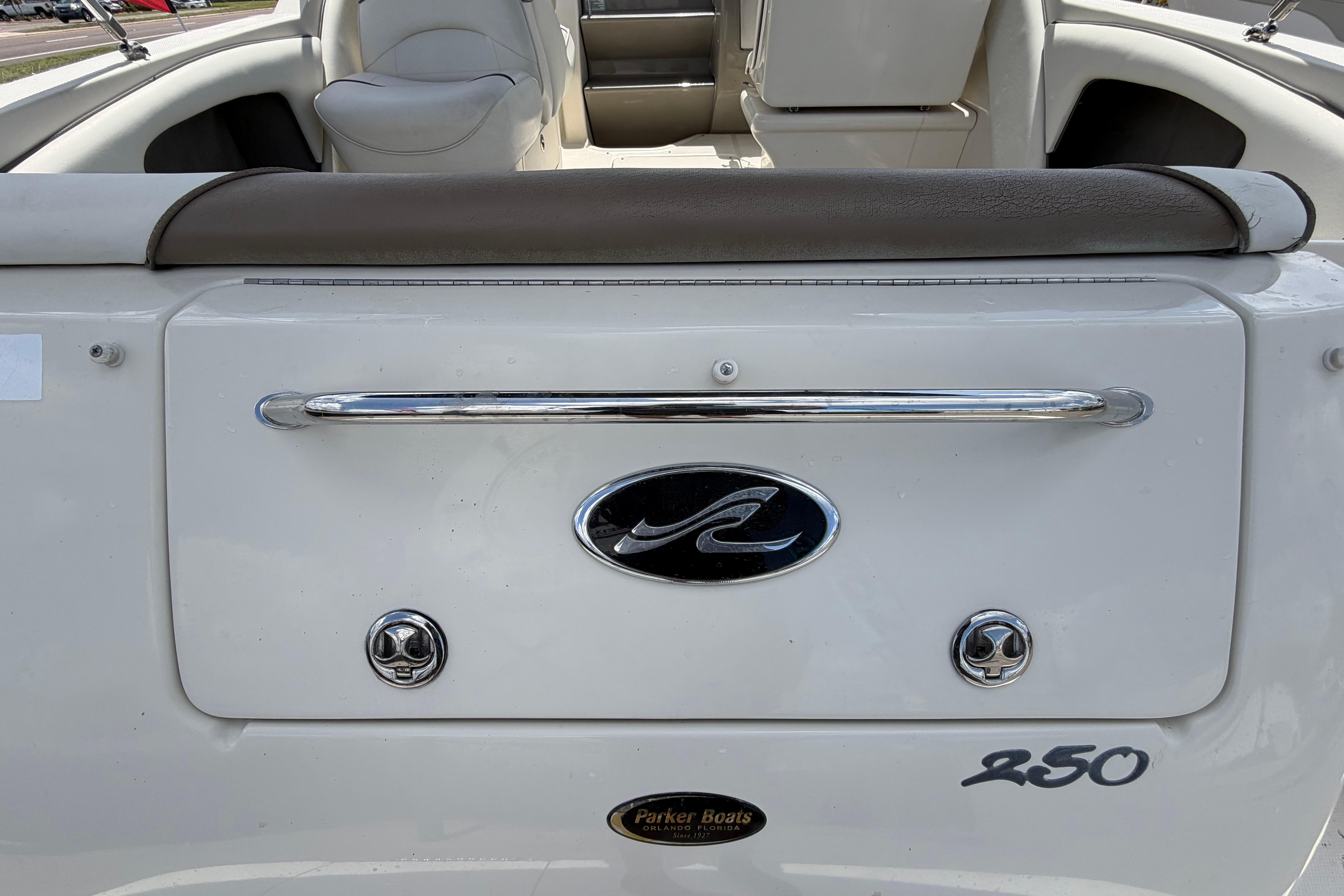 2006 Sea Ray 250 Amberjack boat interior with seating and logo details.