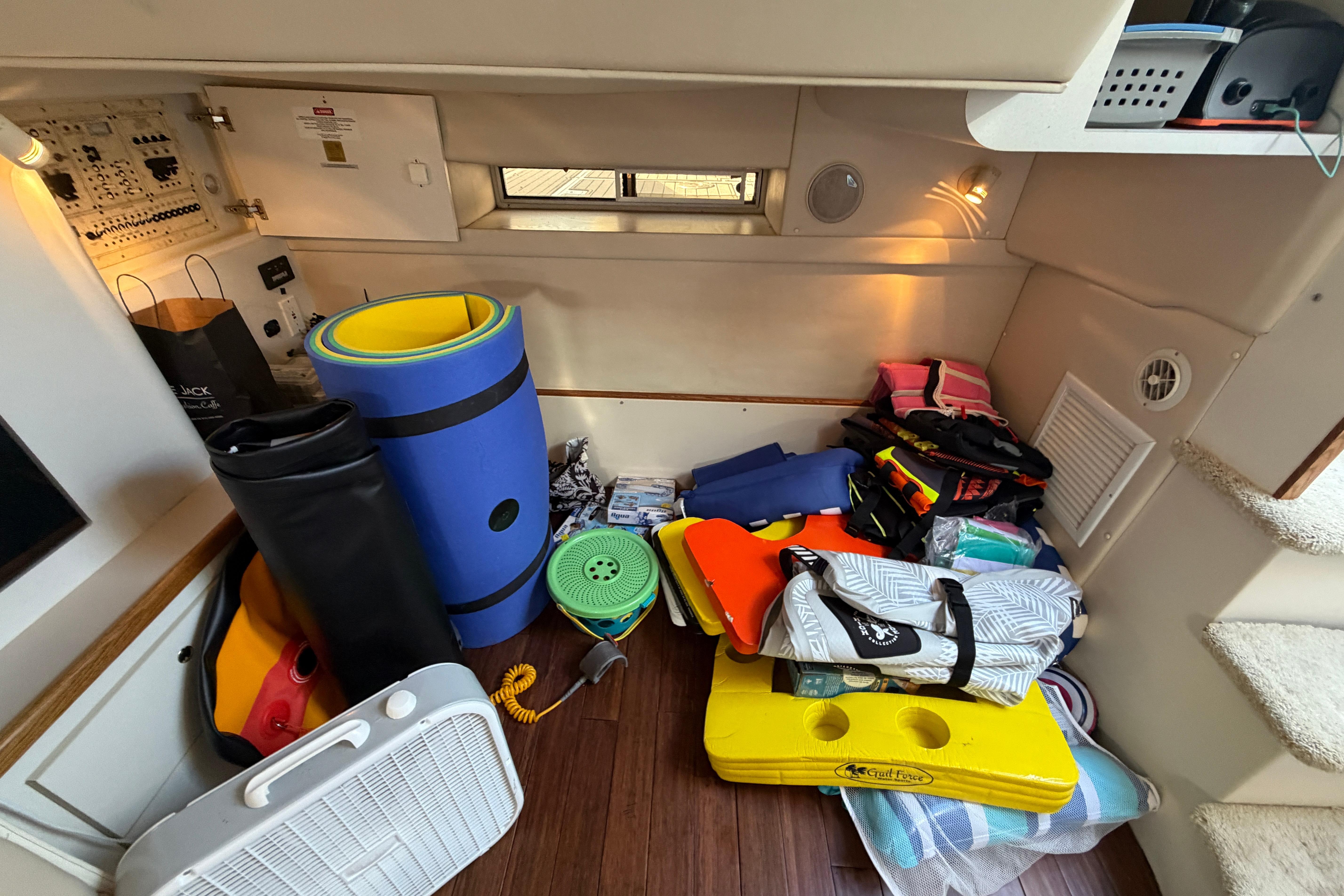 Interior of a 1997 Cruisers 3575 boat with various boating equipment and accessories.