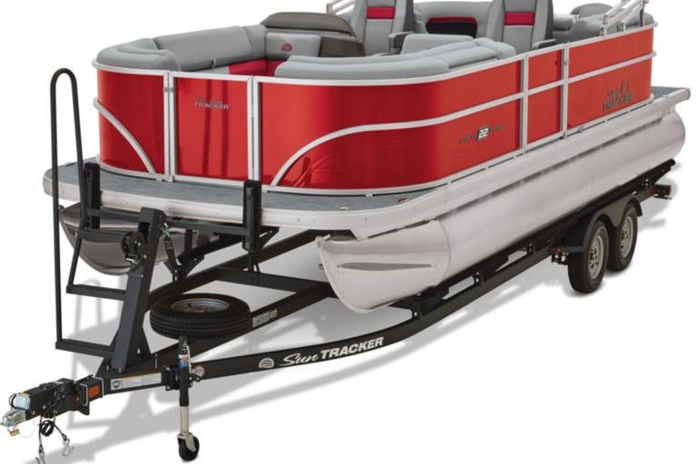 2026 Sun Tracker Party Barge 22 DLX pontoon boat on trailer, red and gray design.