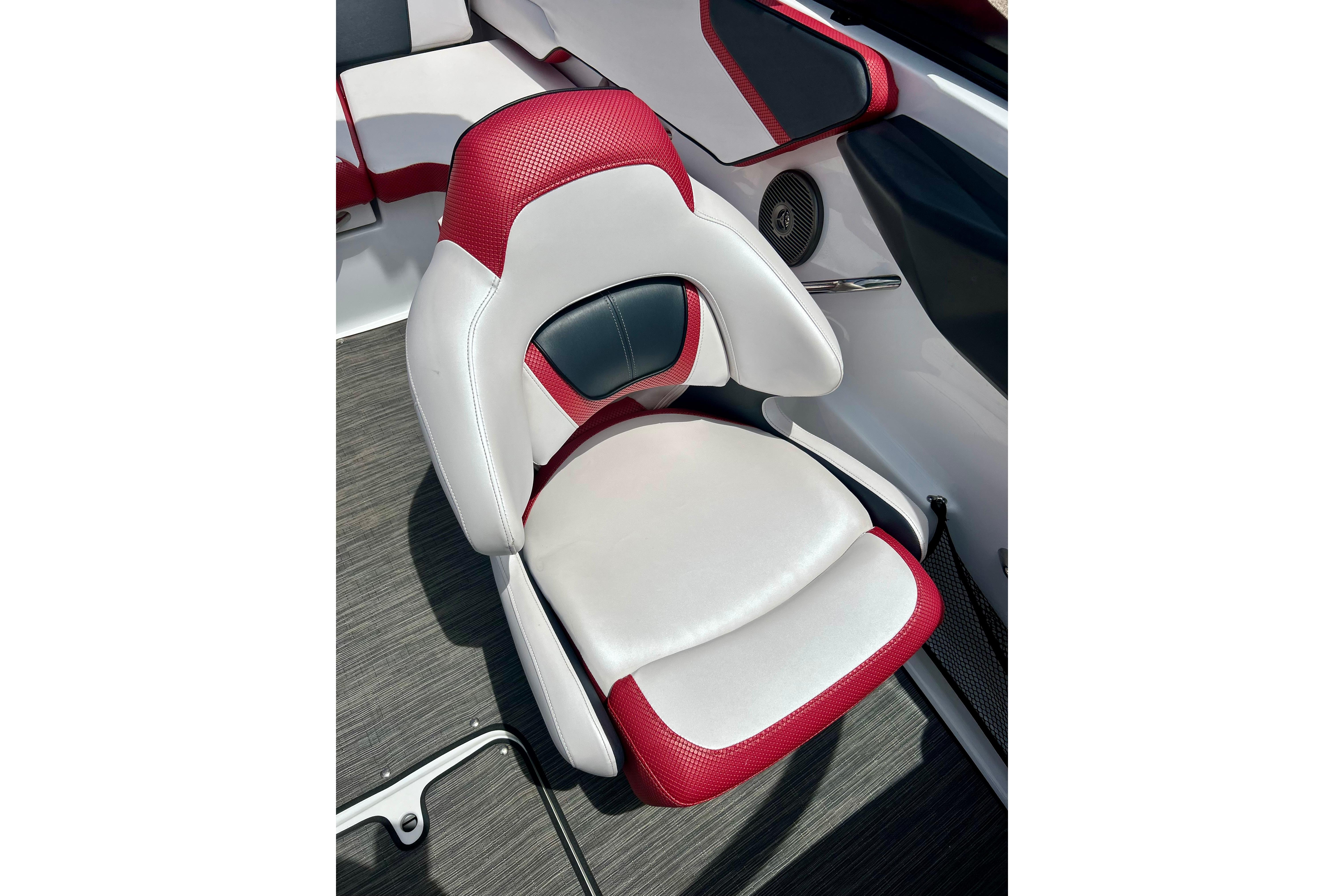 Red and white seat in 2021 Scarab 195 ID boat interior.