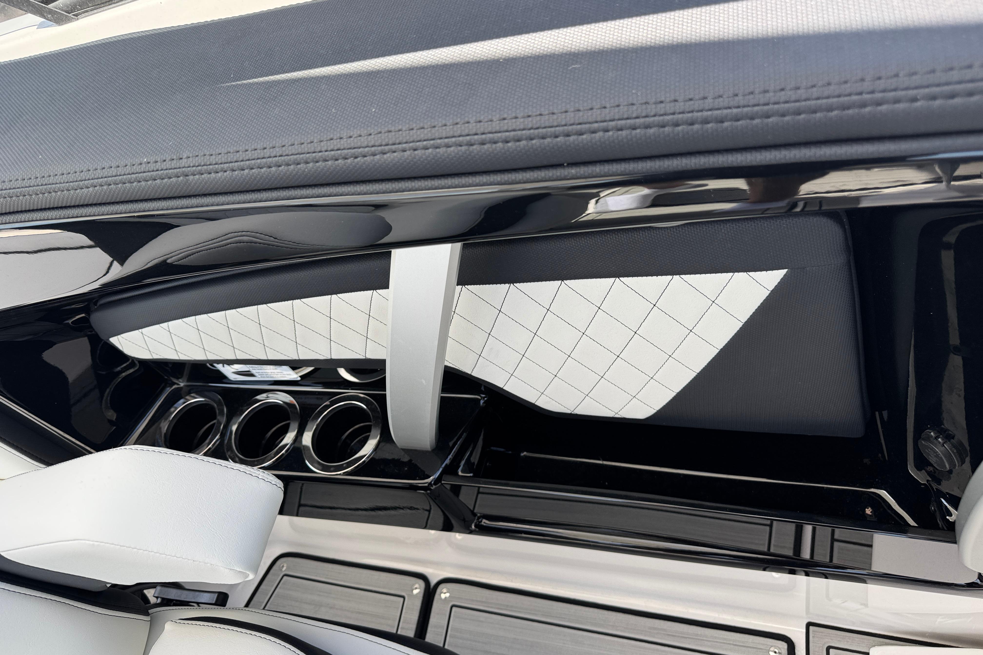 Interior of 2026 Yamaha Boats 275SD, featuring sleek design and cup holders.
