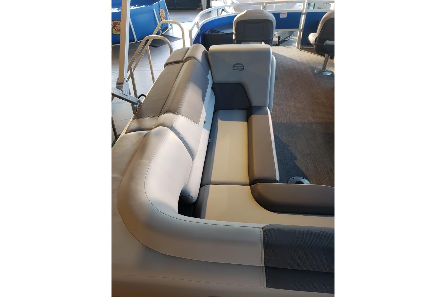 2026 Sun Tracker Fishin' Barge 20 DLX interior seating, featuring comfortable gray upholstery.
