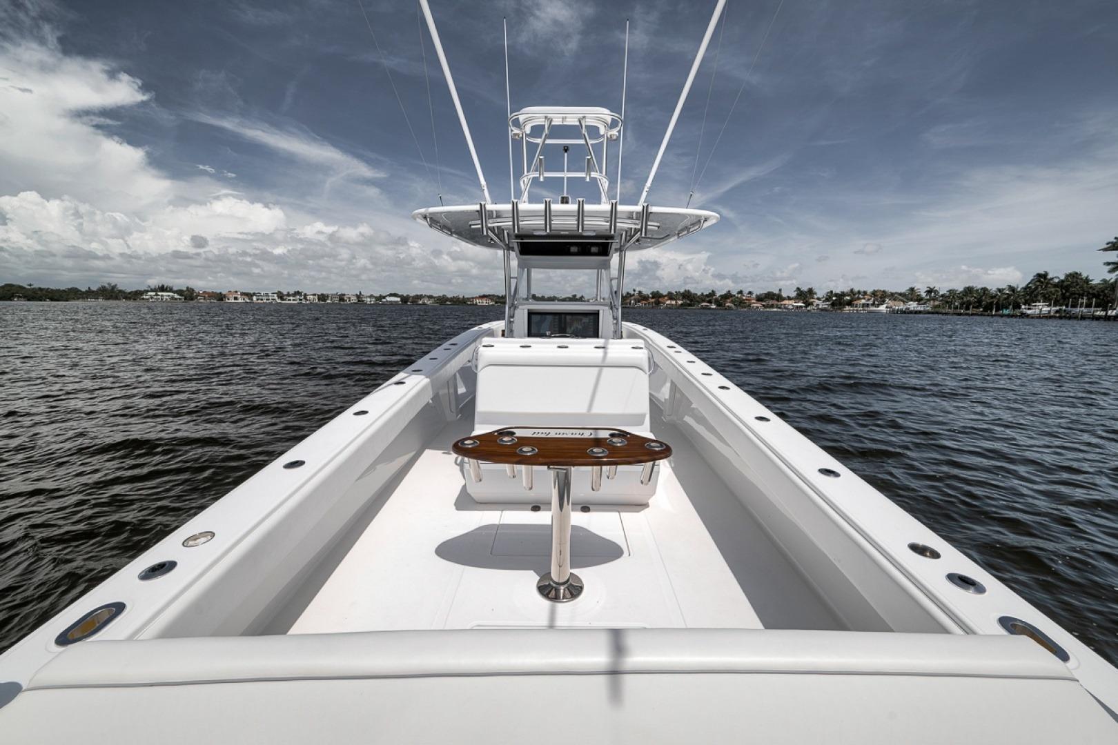 2017 Bahama 41 boat on calm water, showcasing spacious deck and sleek design.