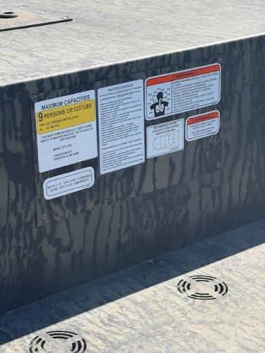 2025 Tracker GRIZZLY 2072 Utility boat capacity and safety labels on deck.