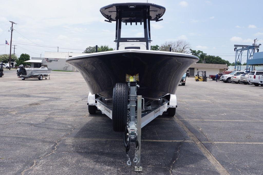 2027 Tidewater 2500 Carolina Bay boat on trailer in parking lot.