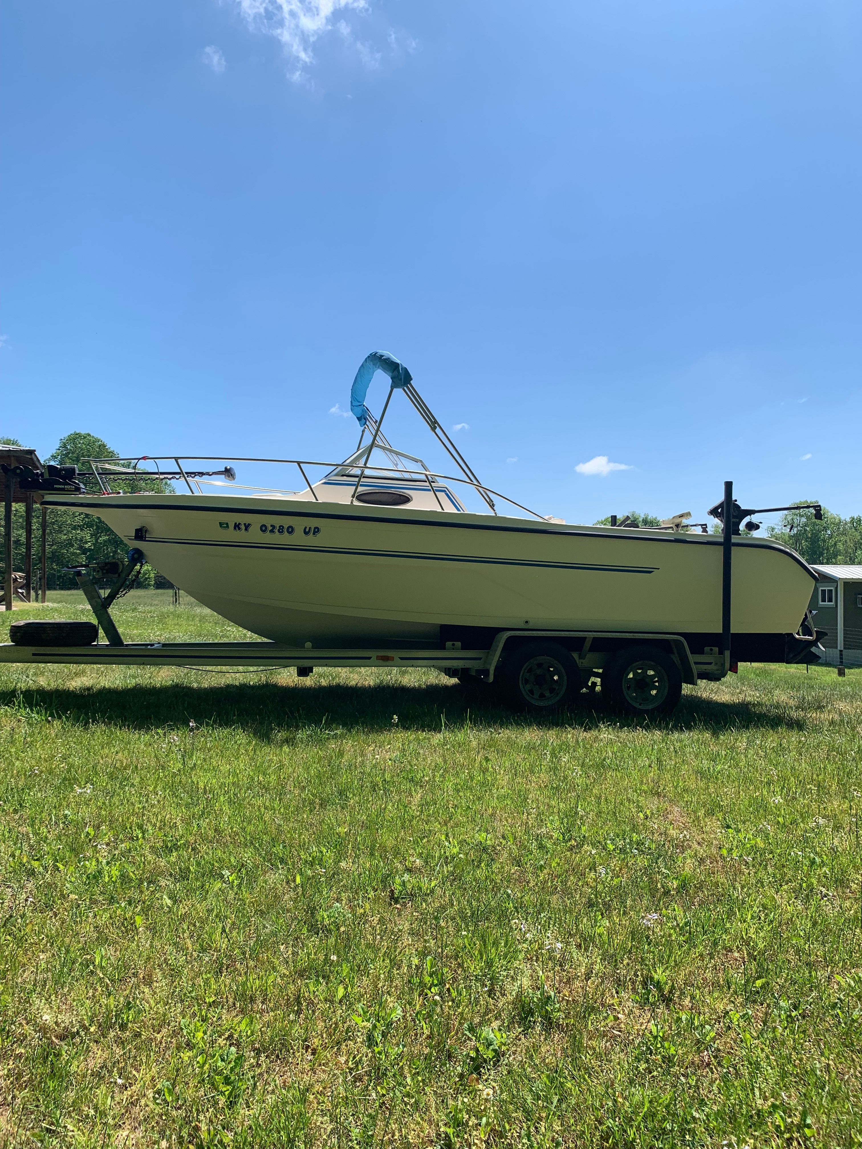1998 Eurosport 221WA boat on trailer outdoors.