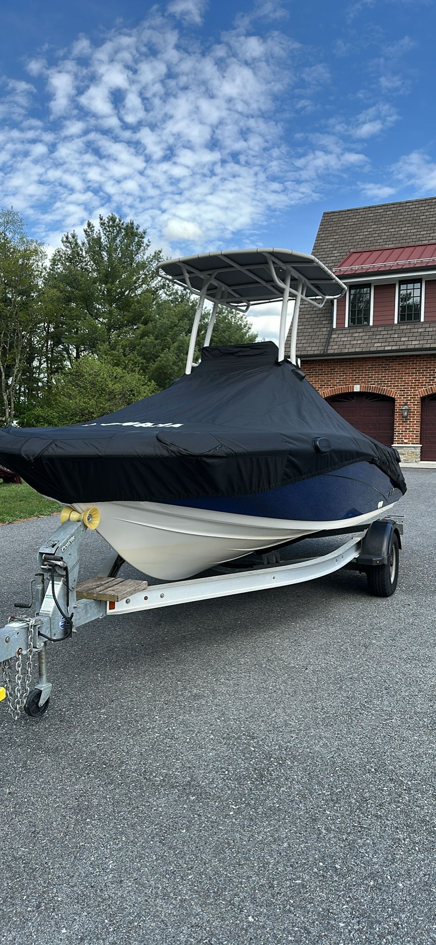 2017 Yamaha 190 FSH Sport boat with cover on trailer.