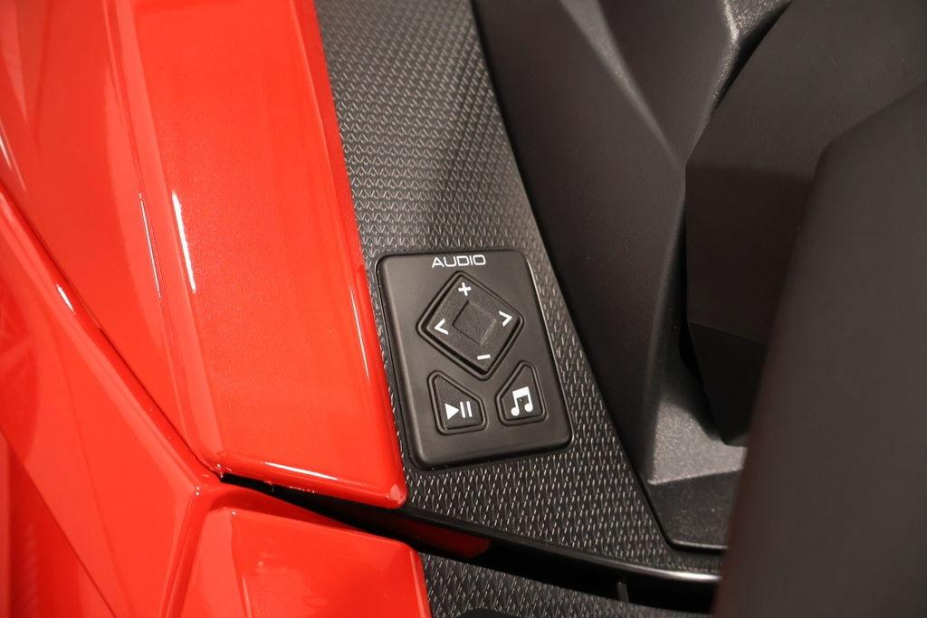 Audio control panel on 2026 Yamaha WaveRunner VX Deluxe, featuring sleek red design.