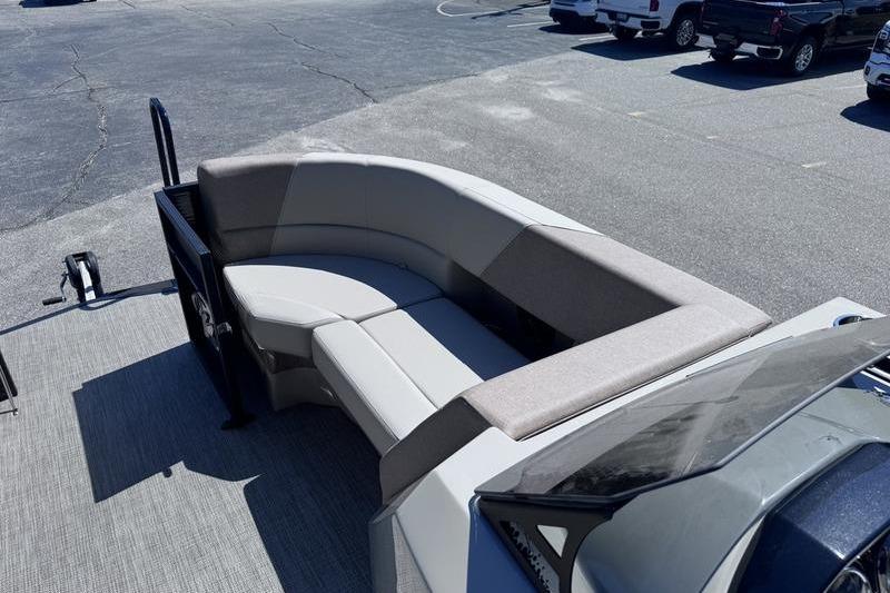 2027 Manitou Aurora 23 RF SHP pontoon boat with spacious seating area.