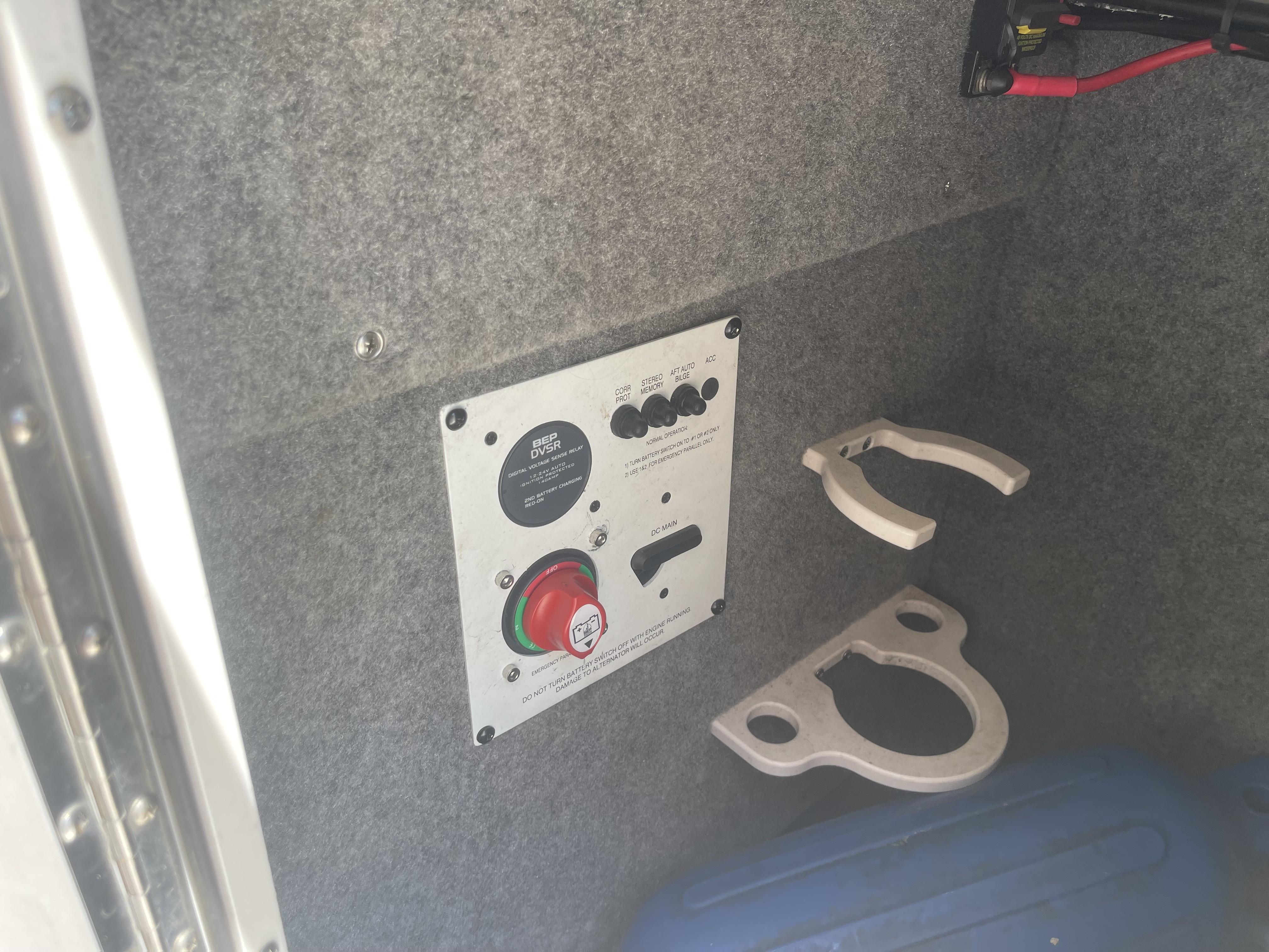 Control panel inside 2014 Chaparral Sunesta 224 boat, featuring switches and battery selector.