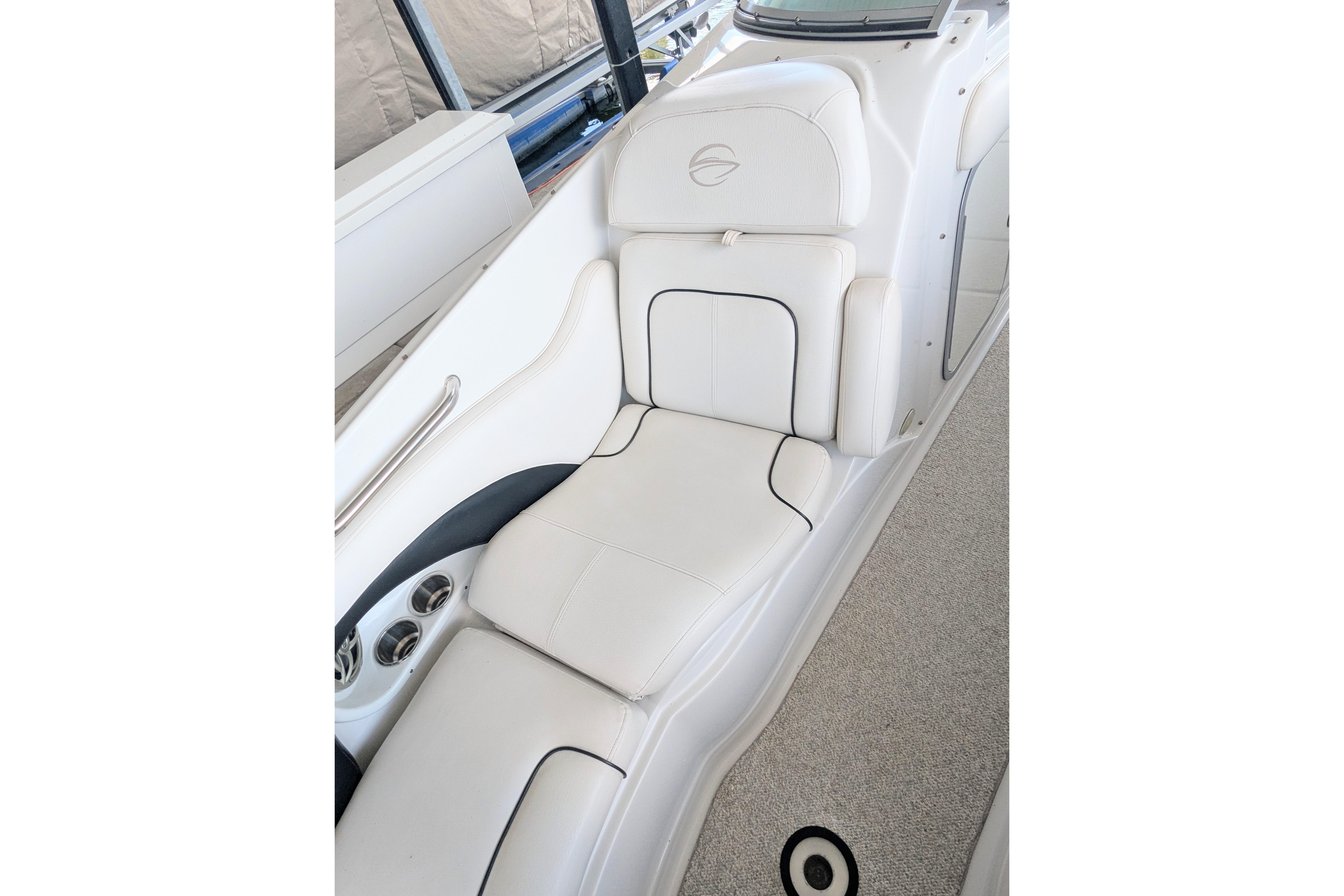 2008 Crownline 300 LS boat interior with white cushioned seating and sleek design.
