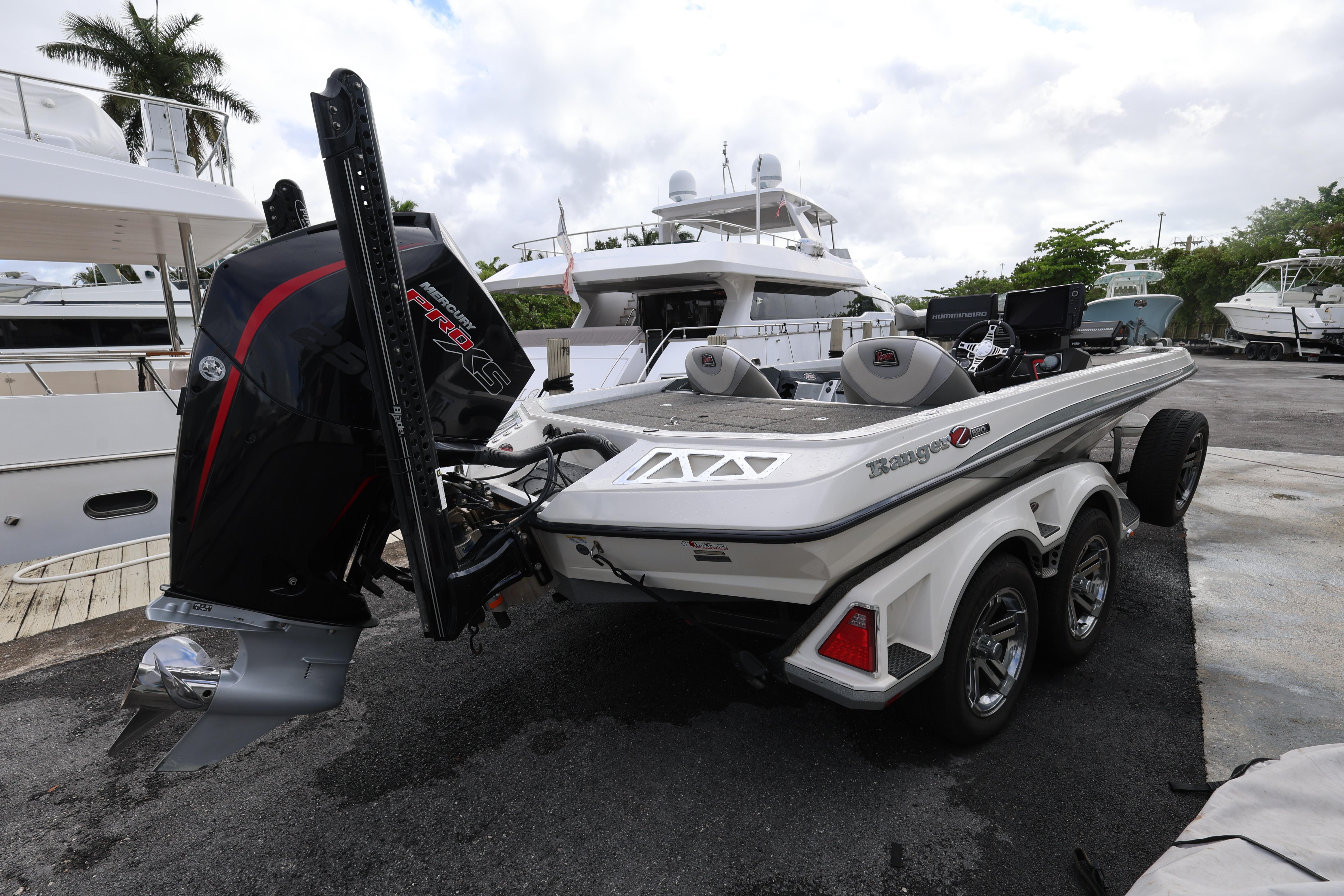 2020 Ranger Z520L boat with powerful outboard motor in a marina setting.