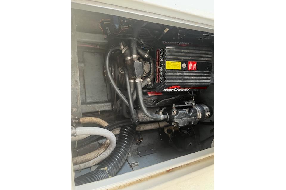 Engine compartment of a 1989 Sea Ray 300 Sundancer with MerCruiser components.