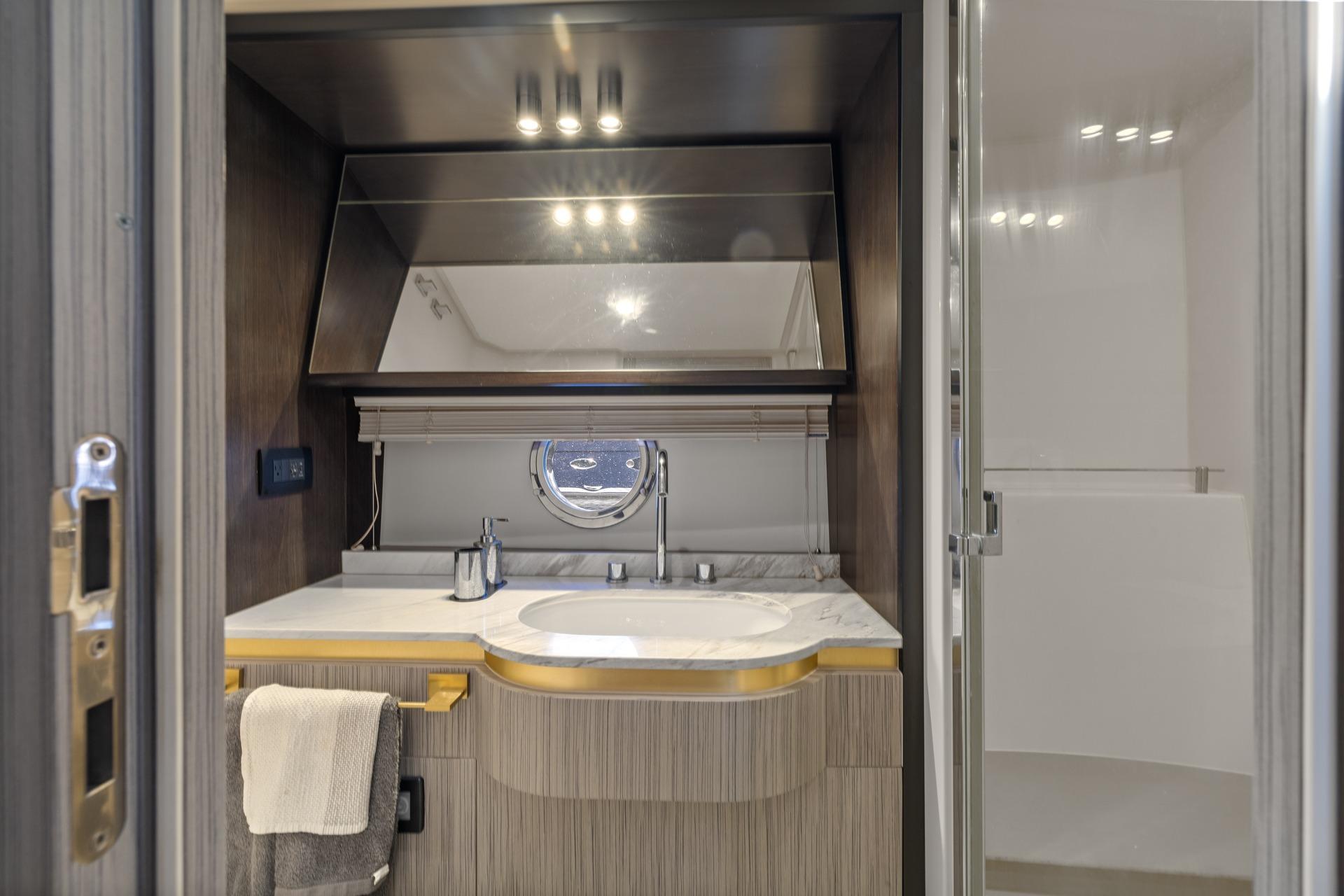Luxurious bathroom interior of 2019 Azimut 55 yacht with modern fixtures and elegant design.