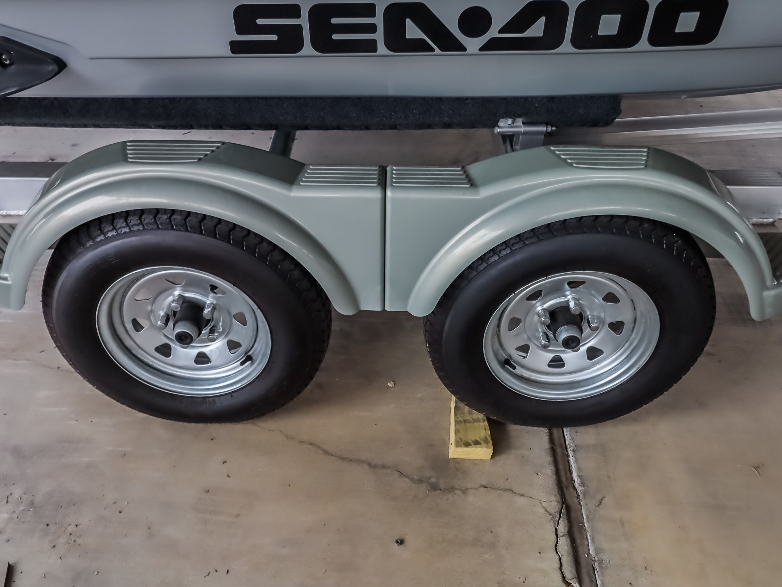 Sea-Doo GTX300 trailer wheels, 2018 model, in a garage.