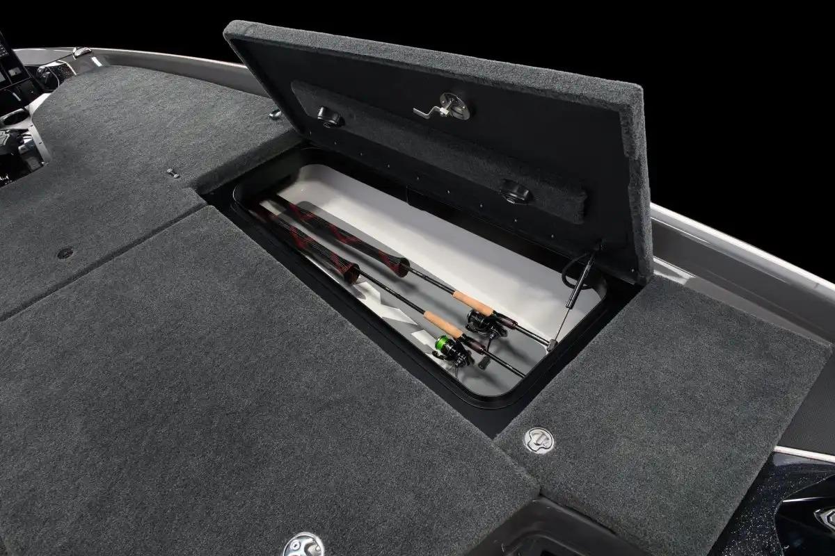 Manufacturer Provided Image: 2026 Skeeter FXR20 FLEX boat with open storage compartment holding fishing rods.