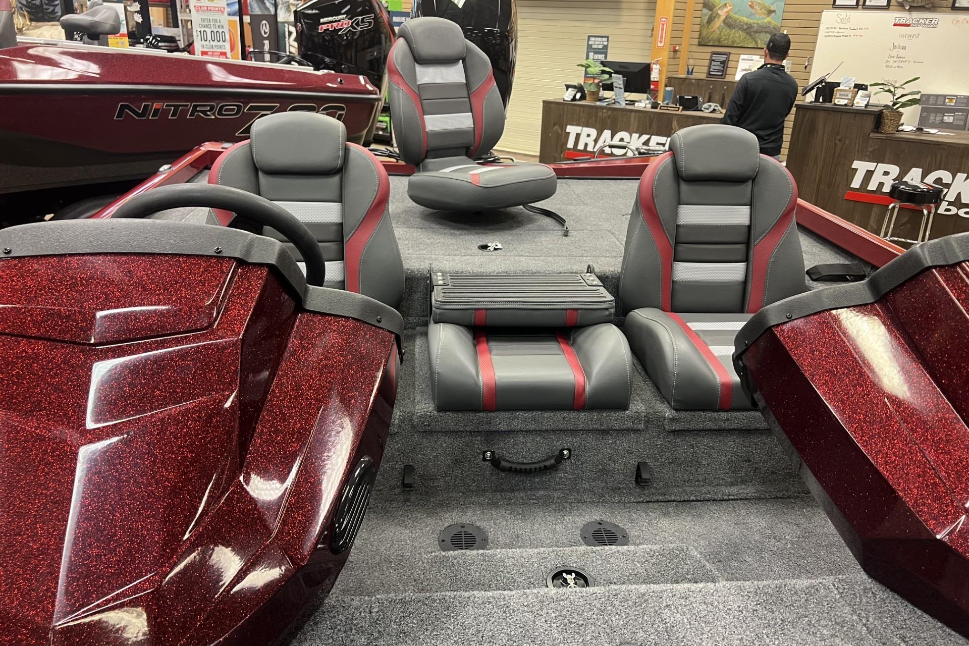 2026 Ranger RT198P boat interior with red and gray seats, showroom display.